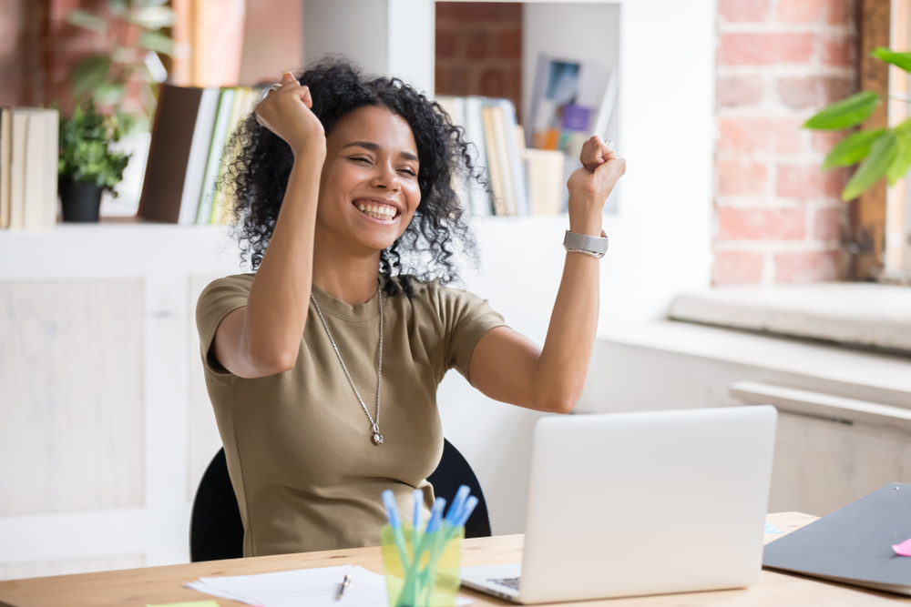 lady happy and cheering in office