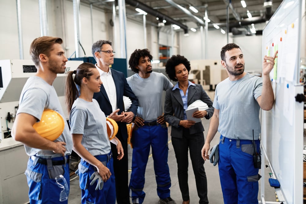 workers and consultants in manufacturing facility